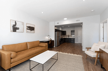 A living room with a couch and a table